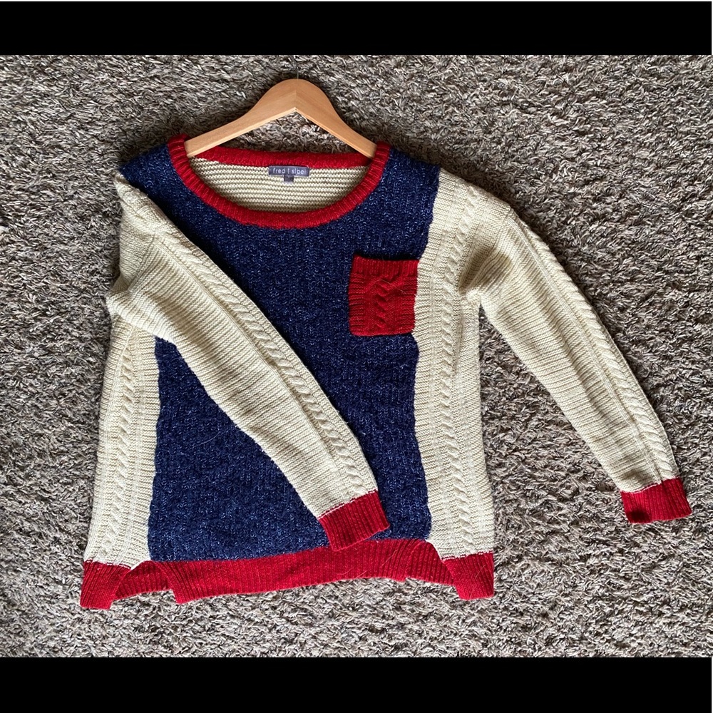 Blue and white with red accent sweater.